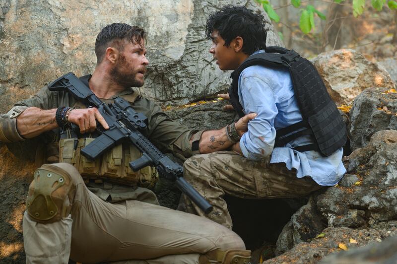 Chris Hemsworth and Rudhraksh Jaiswal in Extraction. Photograph: Jasin Boland