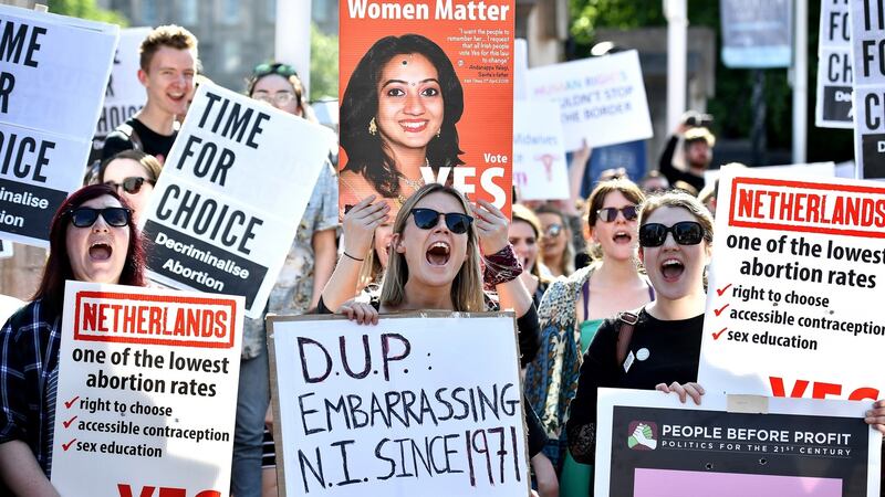 Campaigners are pictured during a rally calling for abortion rights outside Belfast City Hall on Monday. Photograph: Charles McQuillan/Getty Images.