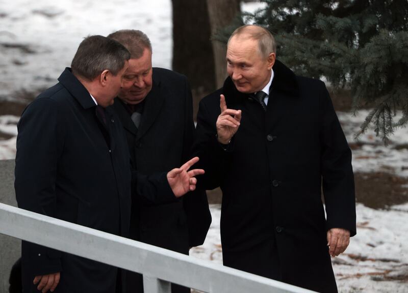 Vladimir Putin talks to regional governors Andrey Bocharov (right) and Vladimir Ustinov (centre) while attending a commemoration of Battle of Stalingrad on Thursday, Photograph: Getty Images