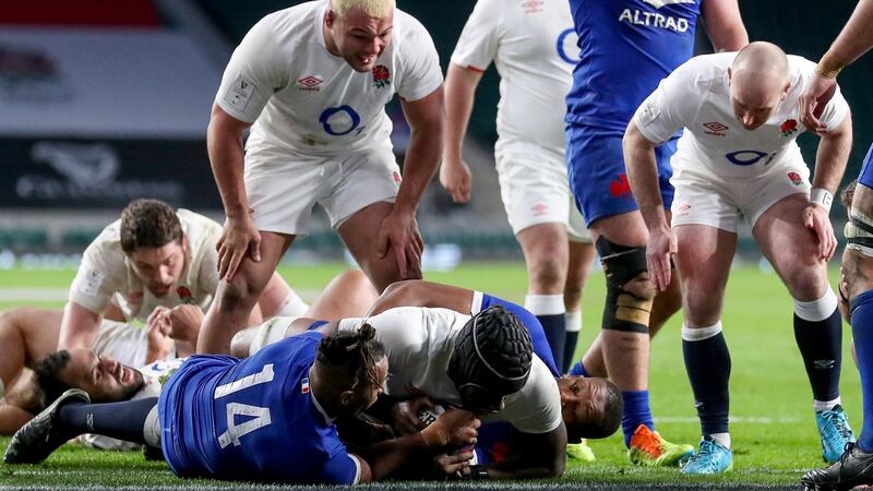 England’s Maro Itoje scores the winning try despite the attempts of France’s Teddy Thomas during the Six Nations game at  Twickenham. Photograph: Andrew Fosker/Inpho