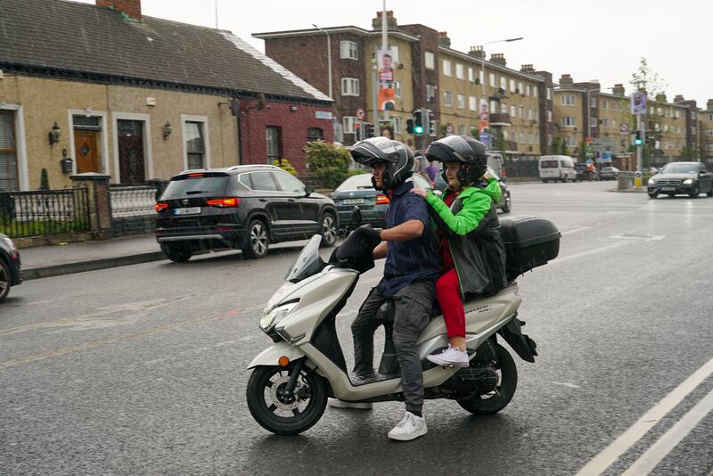 Caio Benício travels with senator Mary Fitzpatrick as they canvass the north inner city. Photograph: Enda O'Dowd