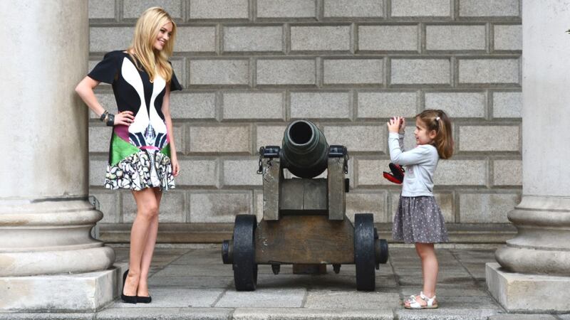 Little girl snaps a photo of Laura Whitmore at the launch of last years Dublin Fashion Festival. Photograph: Alan Betson/ The Irish Times