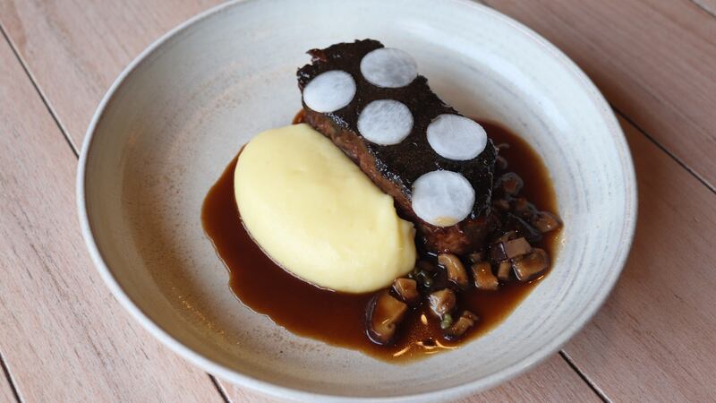 Slow-cooked beef shin, with mushroom duxelles, confit onions and thyme