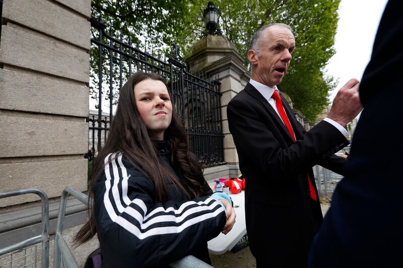 Cara Darmody and her father, Mark Darmody, outside Dáil Éireann. Photograph: Nick Bradshaw 
