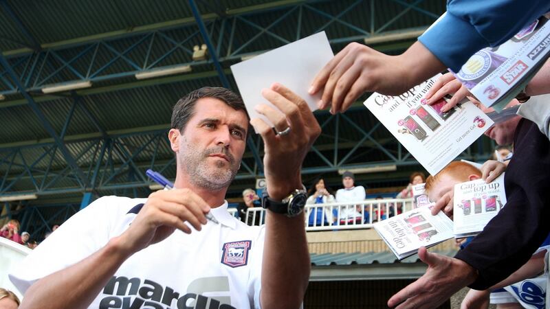 Roy Keane signs autographs in 2009 during his time as Ipswich Town manager. Photograph: Donall Farmer/Inpho