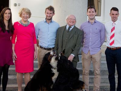 Michael D Higgins, his wife Sabina and their dogs Bród and Síoda meet members of Skibbereen Rowing Club in 2017. Photograph: Tom Honan.
