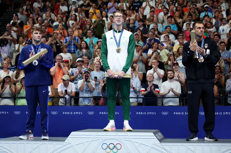 Bobby Finke, Daniel Wiffen and Gregorio Paltrinieri pose with their medals on the podium. Photograph: Adam Pretty/Getty Images