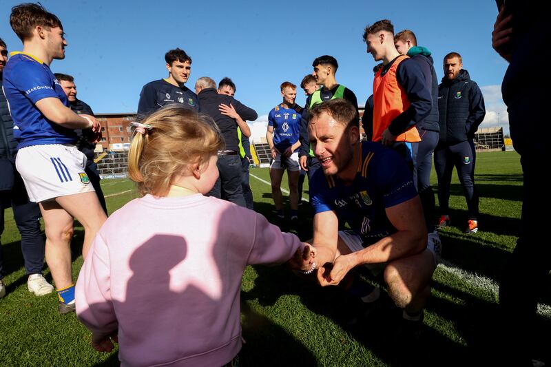 Wicklow's Dean Healy celebrates with his daughter Fia after his side's win over Wesmeath in the Leinster SFC. Photograph: Bryan Keane/Inpho