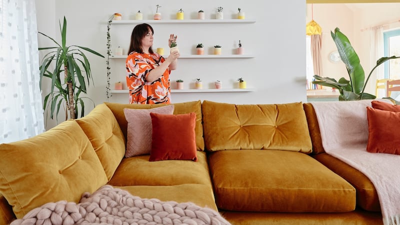 On one wall Condon has created a vertical interior garden of succulents in colourful pots she cast herself