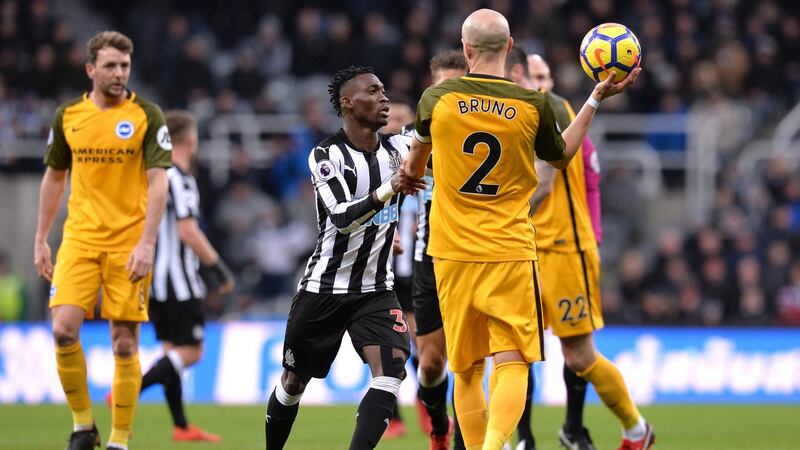 Christian Atsu tries to get the ball off Bruno during Newcastle’s draw with Brighton. Photograph: Mark Runnacles/Getty