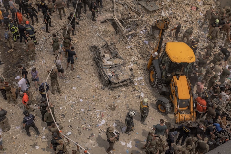 A car lies under the rubble of Ohmatdyt Children's Hospital following a Russian missile attack in the Ukrainian capital of Kyiv. Photograph: Roman Pilipey/AFP via Getty Images