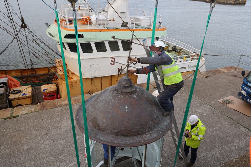 The weather vane is attached before the lift. Photograph: Nick Bradshaw/The Irish Times