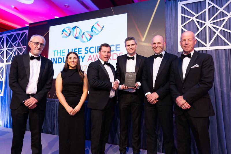Derry Kearney, partner at Cundall, presents the sustainability award to Astellas (Kerry Plant) team
