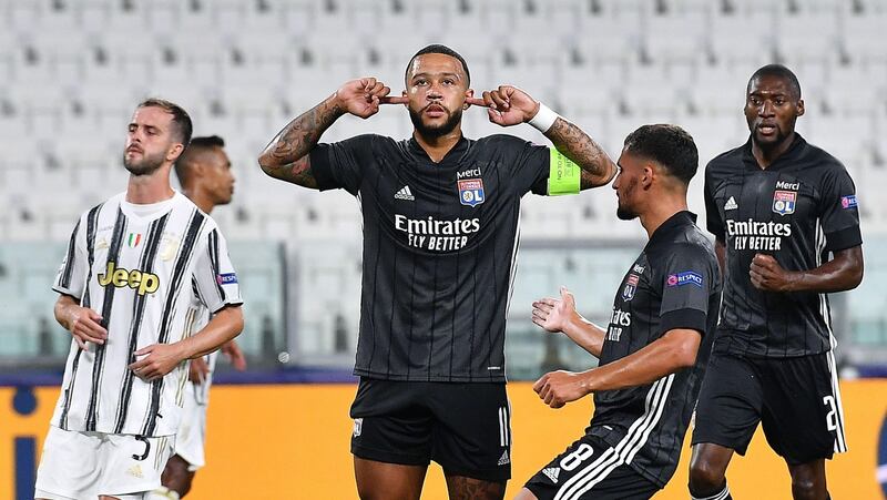 Memphis Depay celebrates after scoring his decisive penalty against Juventus in the Champions League last 16  in Turin. Photograph: Alessandro Di Marco/EPA