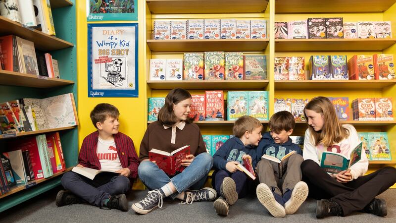Eric and Leonie Mitchell from Waterfall with Eoin, James and April O’Carroll, Ballincollig exploring Dubray’s new bookshop  on Patrick’s Street in Cork. Photograph: Darragh Kane