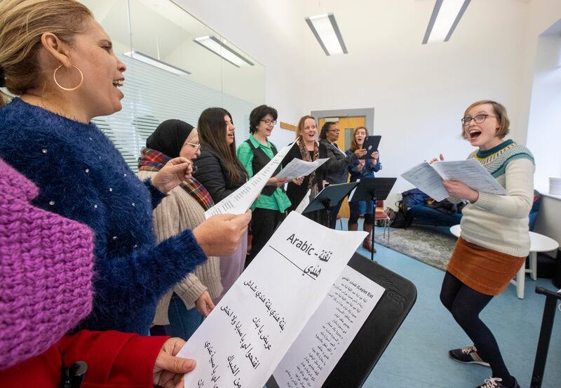 Choir leader Anne McCambridge leads the group during a practice session at the Crescent Arts Centre in Belfast. Photograph: Liam McBurney
