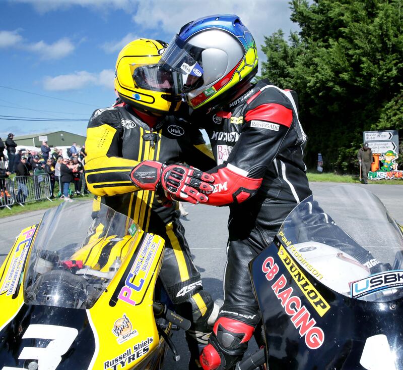 Cousins Gary Dunlop and Paul Robinson embrace after Paul won the Irish 125cc/Moto3 championship at Killalane road races, Co Dublin in 2018.  Photograph: Stephen Davison

