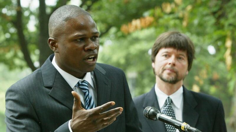Boxer Vernon Forrest speaks while documentary filmmaker Ken Burns looks on during a media conference to discuss a legal petition seeking a posthumous presidential pardon for former boxer Jack Johnson on Capitol Hill in 2004. Photo: Alex Wong/Getty Images