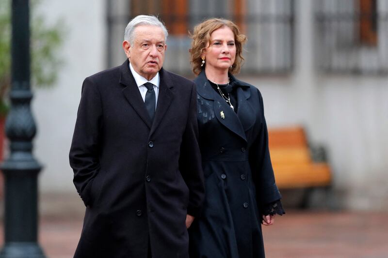 Mexican president Andres Manuel Lopez Obrador and his wife Beatriz Gutierrez Muller arrive at the La Moneda Presidential Palace on Monday to attend a commemoration of the 50th anniversary of Chile's dictatorship in Santiago. Photograph: Javier Torres/AFP via Getty Images