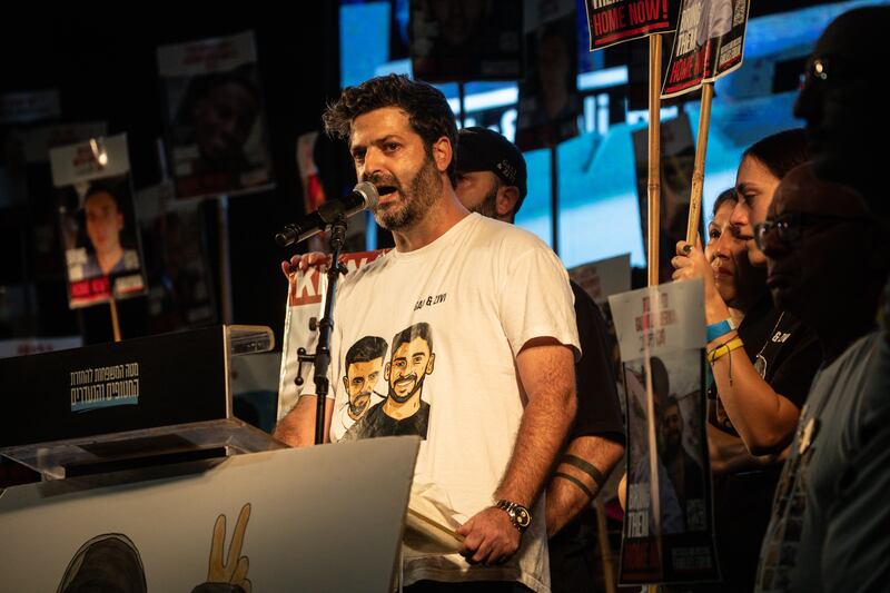 Liran Berman, brother of Israeli hostages Gali and Ziv Berman speaks during a solidarity protest, calling for an end to the war and the release of all remaining hostages. Photograph: Chris McGrath/Getty Images