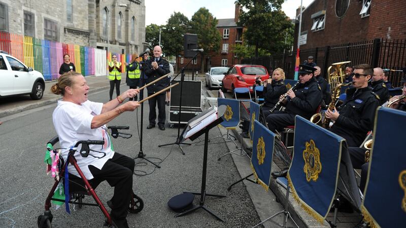 Mary Reilly conducts the Garda band during the Playful Street event held on Sherrif Street. Photograph: Aidan Crawley