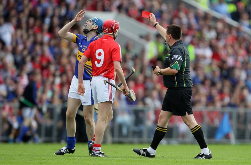 Brian Gavin shows Tipperary's John O'Brien a red card in the 2012 Munster semi-final against Cork. Photograph: Cathal Noonan/Inpho