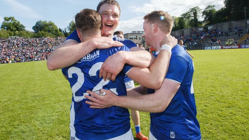 Cavan’s Oisín Pierson celebrates with Gearóid McKiernan and Jack Brady  after his side’s victory over Armagh in the Ulster football semi-final replay at Clones. Photograph: Tommy Dickson/Inpho