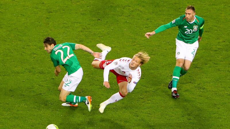 Republic of Ireland midfielder Harry Arter challenges  Kasper Dolberg of Denmark during the Nations League match at the Aviva stadium. Photograph: Oisín Keniry/Inpho