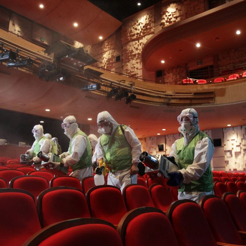 Coronavirus: workers disinfect a theatre in Seoul during the 2015 Mers outbreak. Photograph: Chung Sung-Jun/Getty