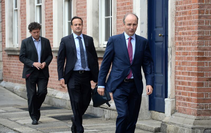 Coalition leaders Micheál Martin, Leo Varadkar and Eamon Ryan leaving Dublin Castle following their first cabinet meeting in 2020. Photograph: Dara Mac Dónail