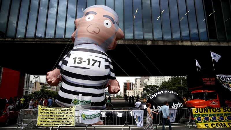 People take part in a protest against former Brazilian president Lula in Sao Paulo on Wednesday. Photograph: Fernando Bizerra jnr/EPA