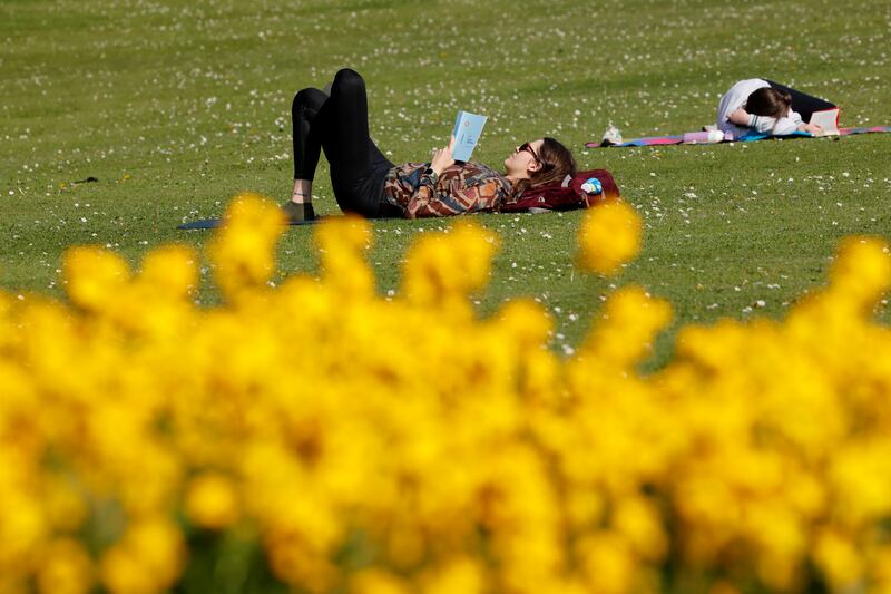 Ada from Dublin enjoying the sunshine and a book in Dublin's Phoenix Park on Tuesday. Photograph: Alan Betson
