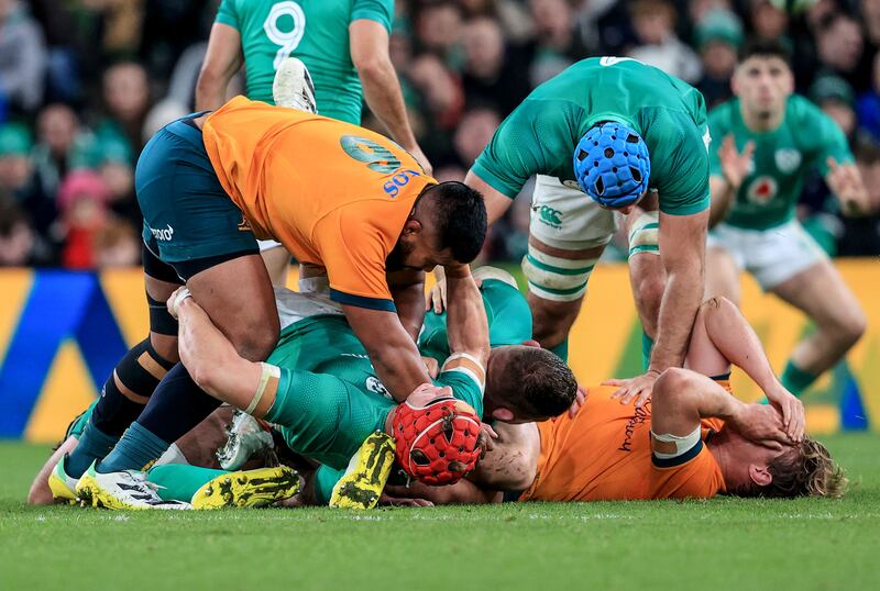Ireland’s Josh van Der Flier and Australia’s Jed Holloway in the ruck. Photograph: Dan Sheridan/Inpho
