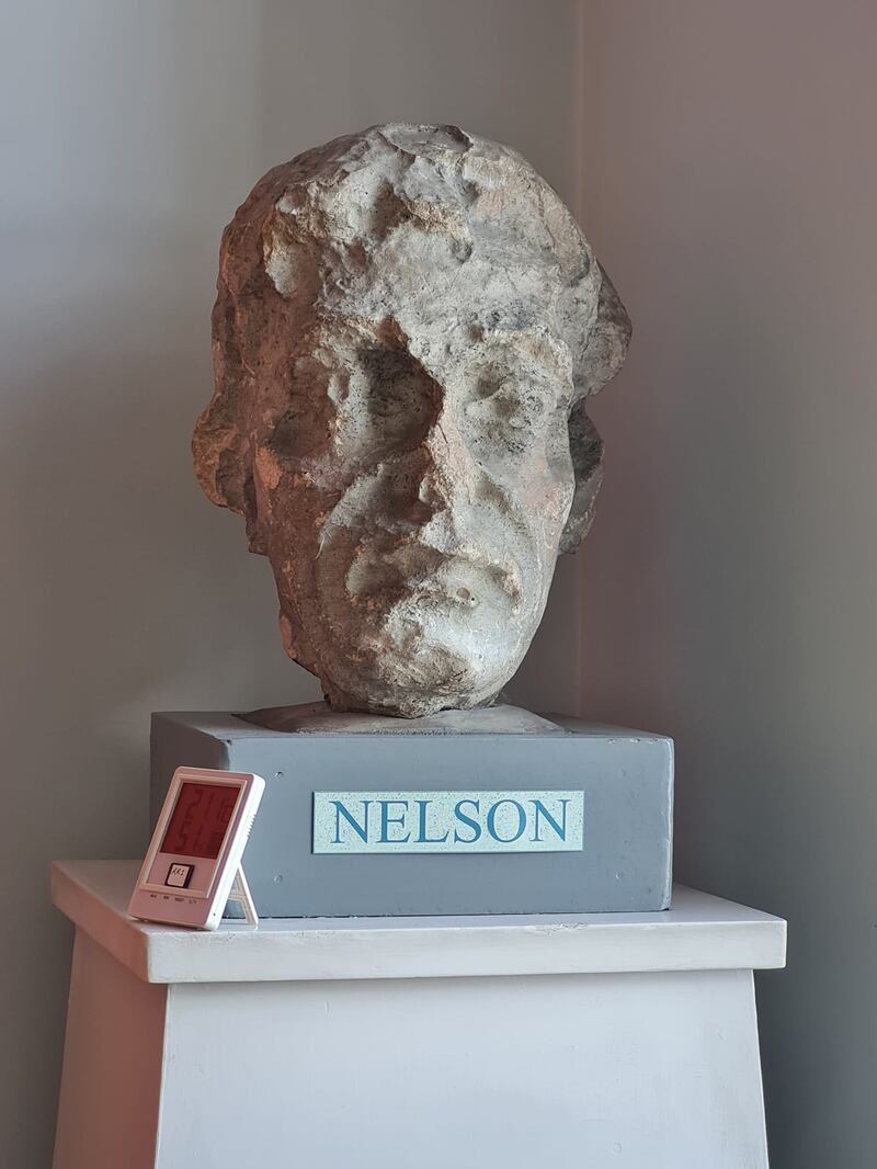 The head from Nelson's Pillar rests on a plinth in the corner of the reading room of the Dublin City Library & Archive at the Gilbert Library on Pearse Street