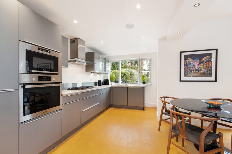 Property's L-shaped kitchen to the rear