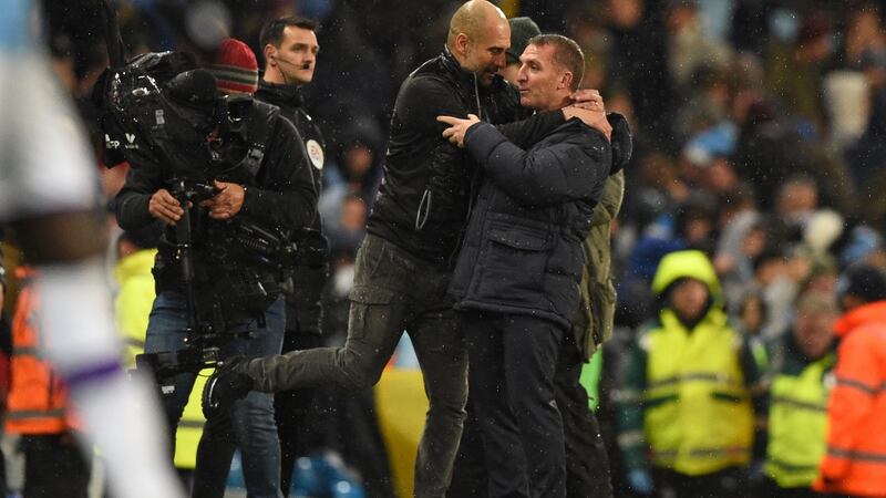 Manchester City’s Catalan manager Pep Guardiola embraces Leicester City boss Brendan Rodgers after their match on Saturday. Photograph: Ollie Scarff/Getty Images