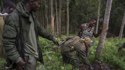 Government soldiers inspect the body of a militia member, after clashes that delayed health workers from reaching the village of Luseghe, where an Ebola outbreak was reported, in the Democratic Republic of Congo, in December, 2018. Photograph: Diana Zeyneb Alhindawi/The New York Times