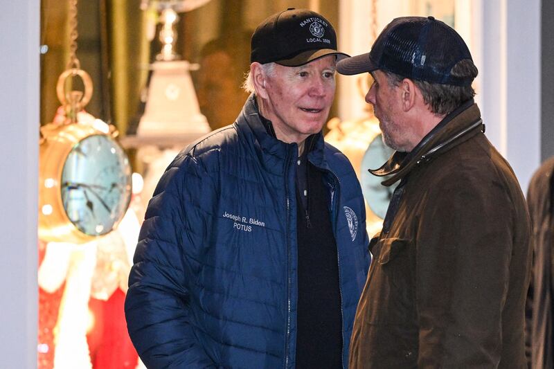US president Joe Biden talks to his son, Hunter, while they shopped in Nantucket, Massachusetts, during the Thanksgiving holiday last November. Photograph: Mandel Ngan/AFP via Getty Images