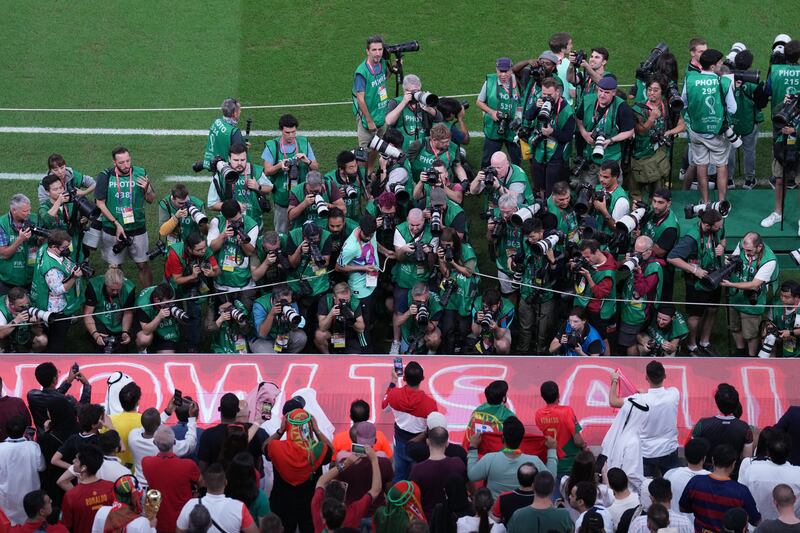Photographers take pictures of Portugal's Cristiano Ronaldo on the bench prior to the World Cup Round of 16 match against Switzerland at Lusail Stadium. Photograph: Peter Byrne/PA Wire
