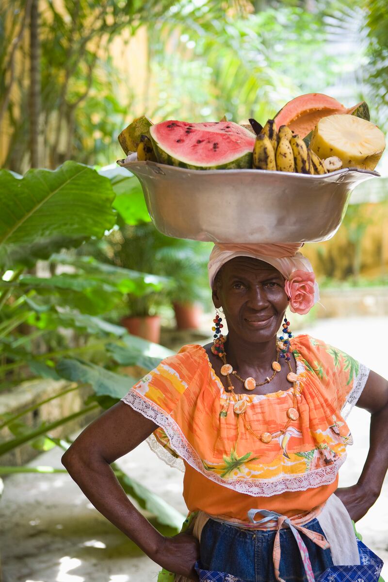 Cartegena: Street vendors orignally from San Basilio de Palenque, the first free town founded by self-emancipated African slaves in the Americas, are known as 'palenqueras'