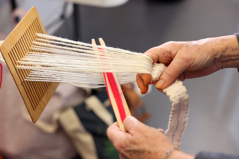 Siobhan Lynam, on rigid heddle loom back strap, at work. Photograph: Dara Mac Dónaill 