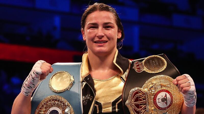 Katie Taylor with the WBA & IBF World Lightweight Championship belts after victory over Kimberly Connor at the  O2 in  London. Photograph: Gary Carr/Inpho