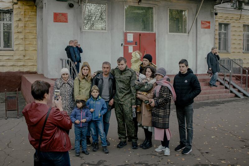 Conscripted Russian men say goodbye to relatives at a recruiting office in Moscow on October 11th, 2022. Photograph: Nanna Heitmann/The New York Times