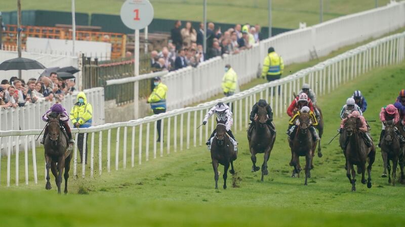 Frankie Dettori and Snowfall stretch away from the field on the way to winning the Cazoo Oaks by 16 lengths at Epsom. Photograph: Alan Crowhurst/Getty Images