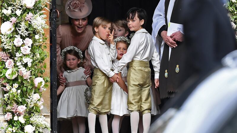 Britain’s Duchess of Cambridge (left) stands with her daughter Princess Charlotte, (bottom left), as they arrive for the wedding. Photograph: Justin Tallis/Reuters.