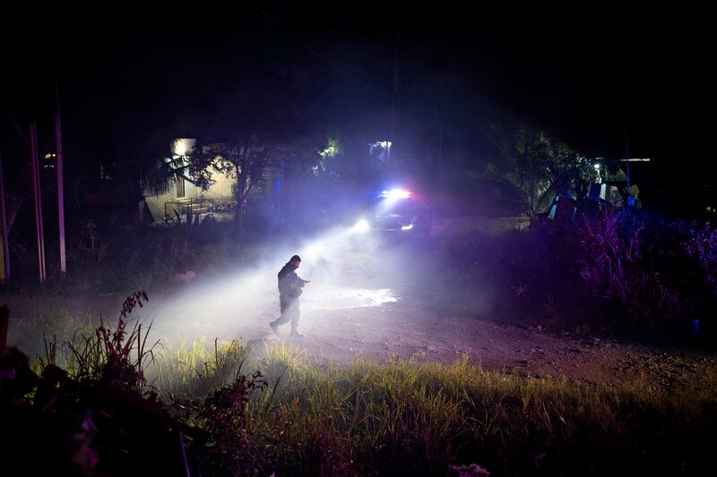 Police at the scene of a fire on the outskirts of Cancún, Mexico on December 19th, 2018. Alberto Capella, the former police chief of the Mexican state of Morelos who created his own clandestine witness protection program there that included a cartel assassin, is now chief in the state of Quintana Roo, which includes Cancún. Photograph: Tyler Hicks/The New York Times