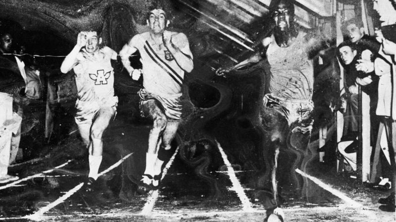 Kofi Annan, right, breaking a 12-year record for the 60 yards sprint at Carleton Stadium at Macalester College, St Paul, Minnesota in the US. Photograph: EPA/United Nations