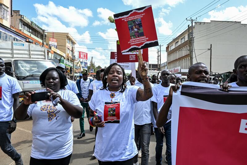 Activists and athletes carry banners and chant slogans as they march through Eldoret, western Kenya, ahead of the funeral of Rebecca Cheptegei. Photograph: Brian Ongoro/AFP