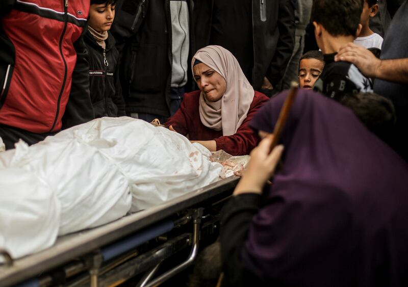 Mourning a victim on an Israeli air strike in Khan Younis. Photograph: Yousef Masoud/The New York Times
                      