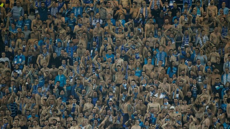 Zenit St Petersburg fans celebrate during the game. Photograph: Maxim Shemetov/Reuters